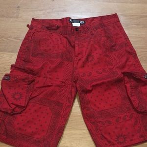 A pair of red shorts with Planck print from the company “hova””